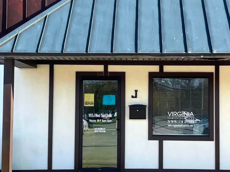 A building with a door and window on the outside.