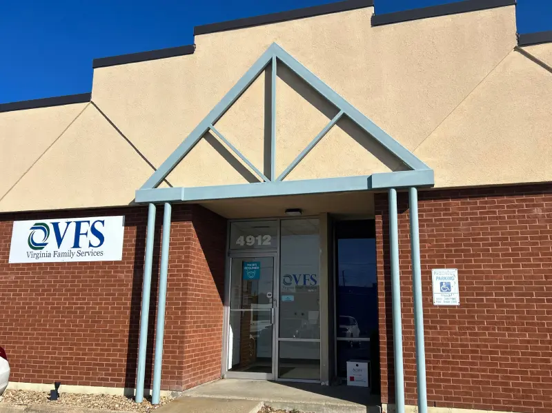 A building with two doors and a sign on the front.